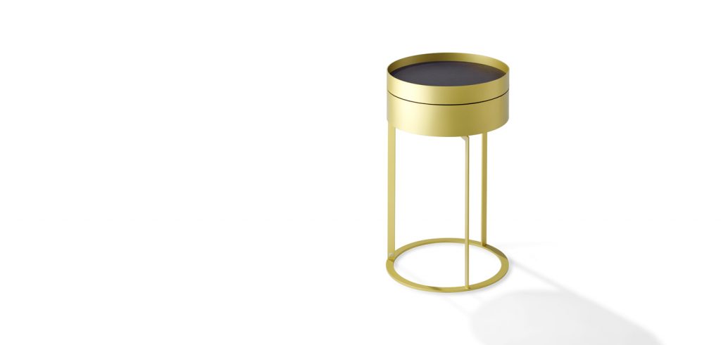 nightstand with compartment made of cylinder-shaped brass base in a gold tone on a white background