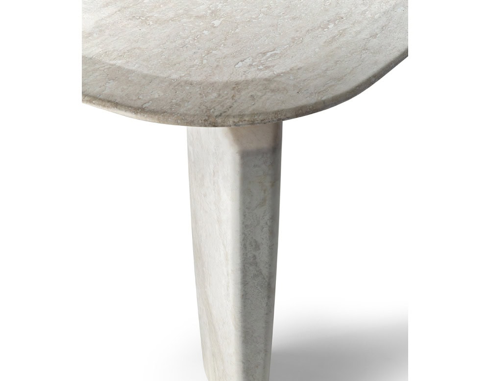 A close-up of a Giotto Outdoor Dining Table shows a white marble tabletop corner and a tapered leg against a white background