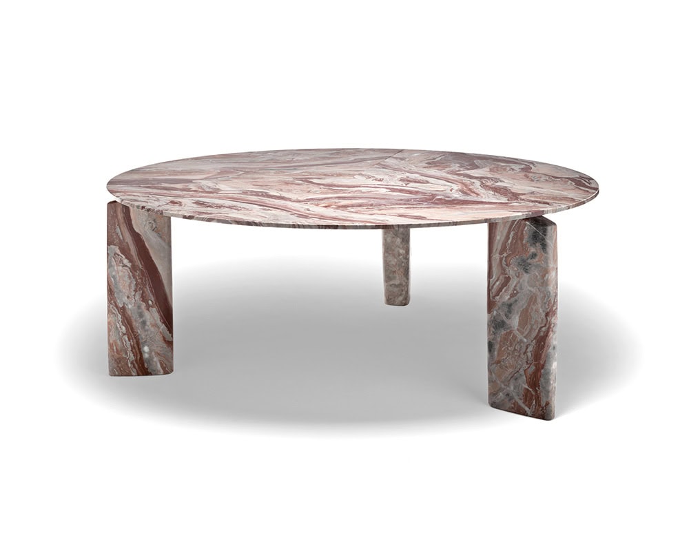 A Giotto Outdoor Dining Table with an oval top and block legs made of marble with a swirling pattern is shown on a white background