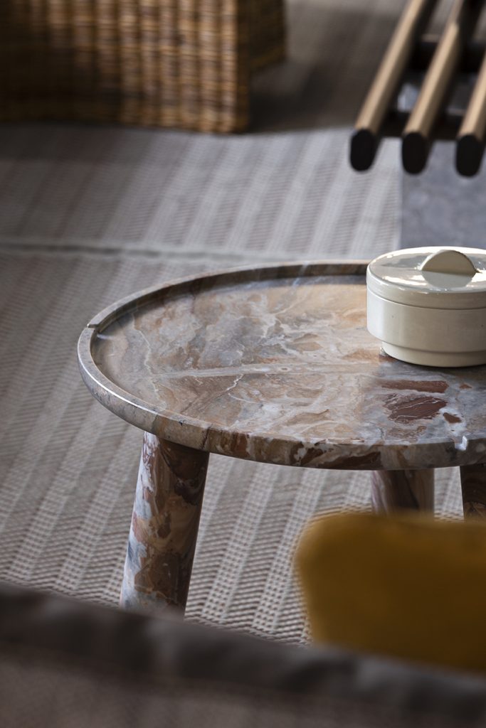 small stone round marble table with sugar caddy on top