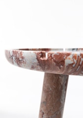 close up view of the stone round coffee table in brown marble