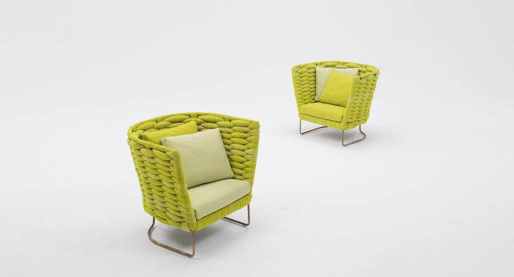 Two yellow Ami Indoor Armchairs. Structure upholstery of woven fabric, seat cushion of fabric, structure and leg in steel on a white background.