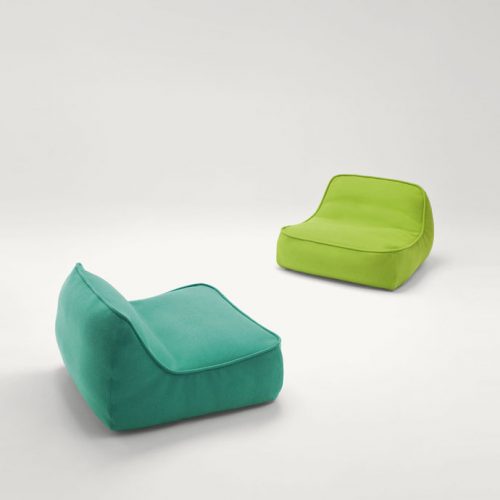 Two Float-Float mini easy chairs, upholstey in spaced fabric, one in green and one in blue on a white background.