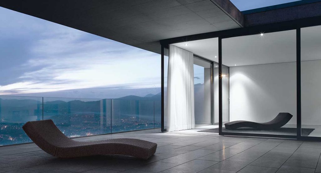 Two Linea chaise longue, upholstery in grey fabric in a living room.