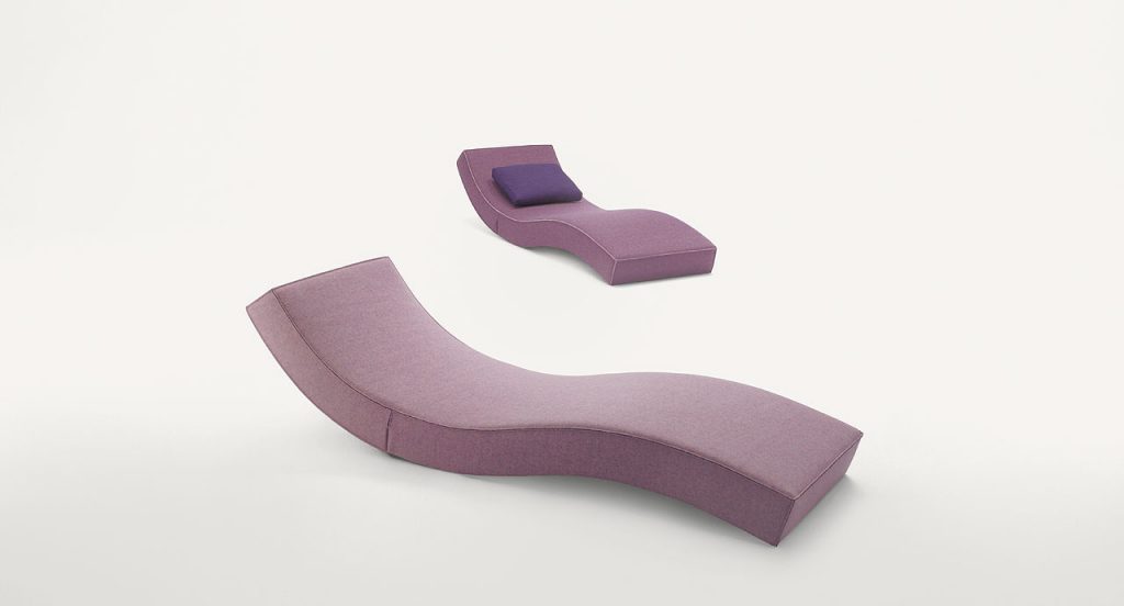 Two Linea chaise longue, upholstery in pink fabric on a white background.