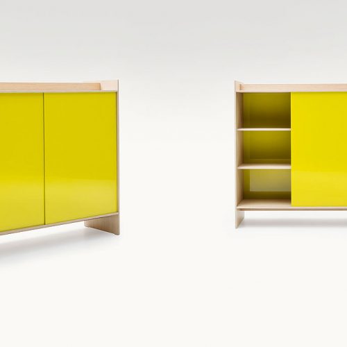 Two Euclide cabinets case in natural fibreboard, doors in yellow aluminium on a white background.
