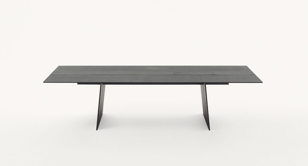 Black Kanji Dining Table, top in natural fibreboard and two legs in wood on a white background.