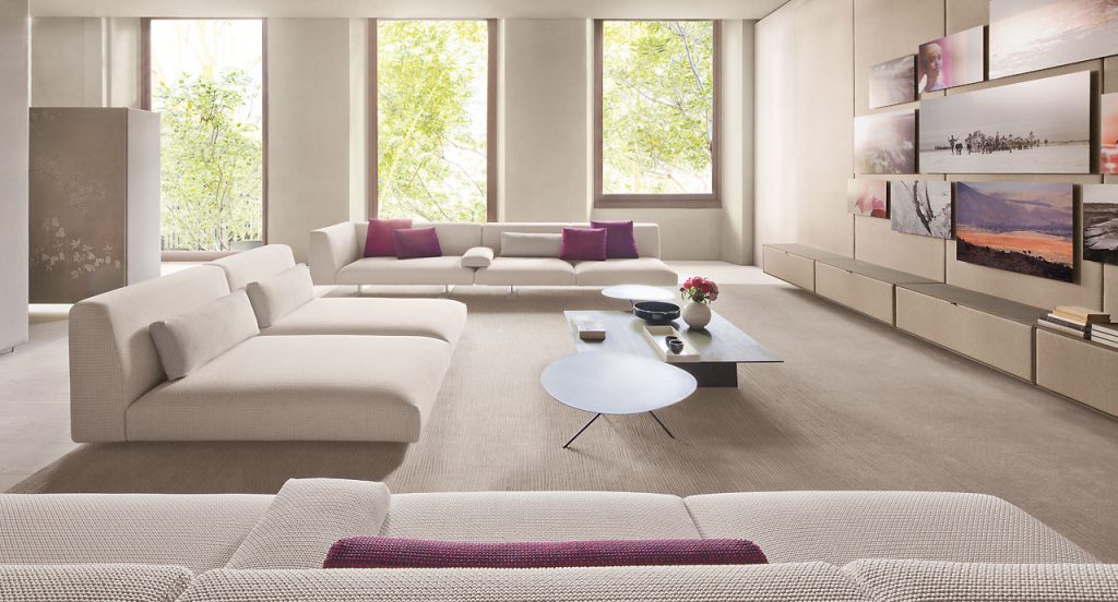 Two Lever Indoor Coffee Tables, top in black and central leg in black steel in a living room.