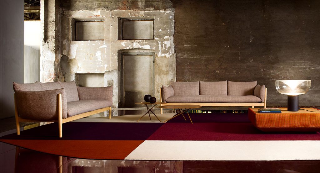 Three Lever Indoor Coffee Tables, top in yellow and four legs in yellow steel in a living room.