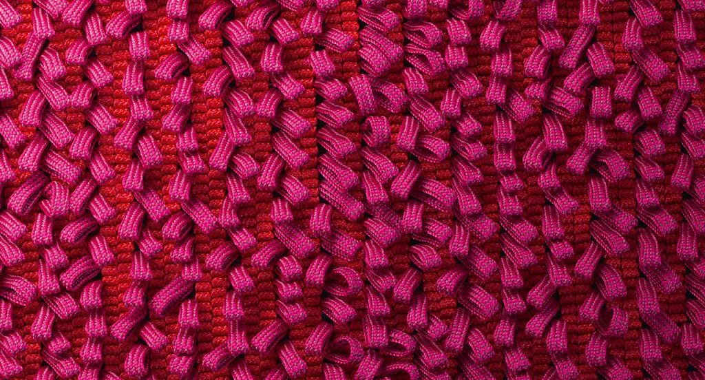 Air rug, texture of pink boucle stitches made of rope braid.