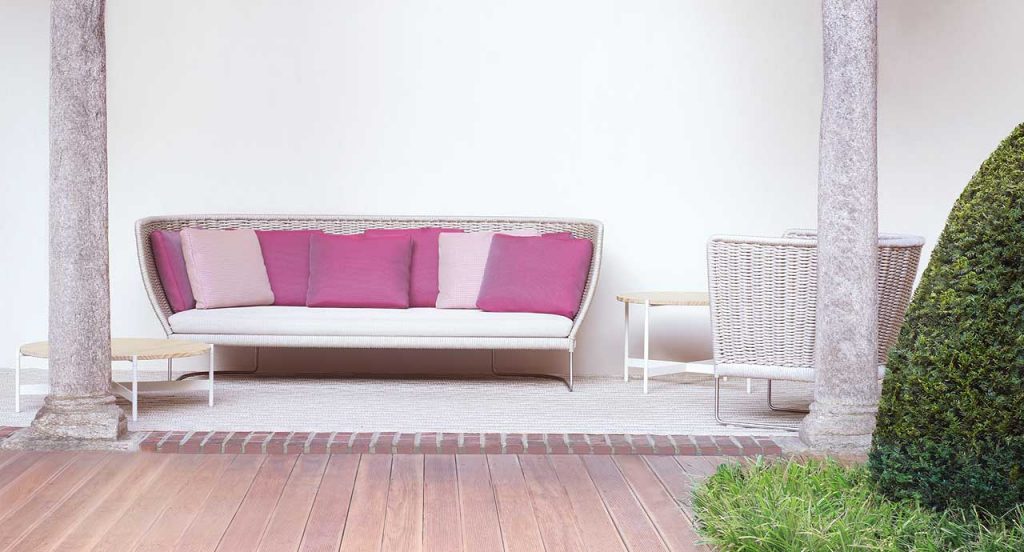 Ami Outdoor Sofa, structure and two legs in steel, structure upholstery in beige cord, white seat cushion in a terrace.