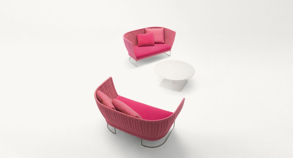 Two Ami Outdoor Sofas, structure and leg in steel, structure upholstery in pink cord, pink seat cushion on a white background.