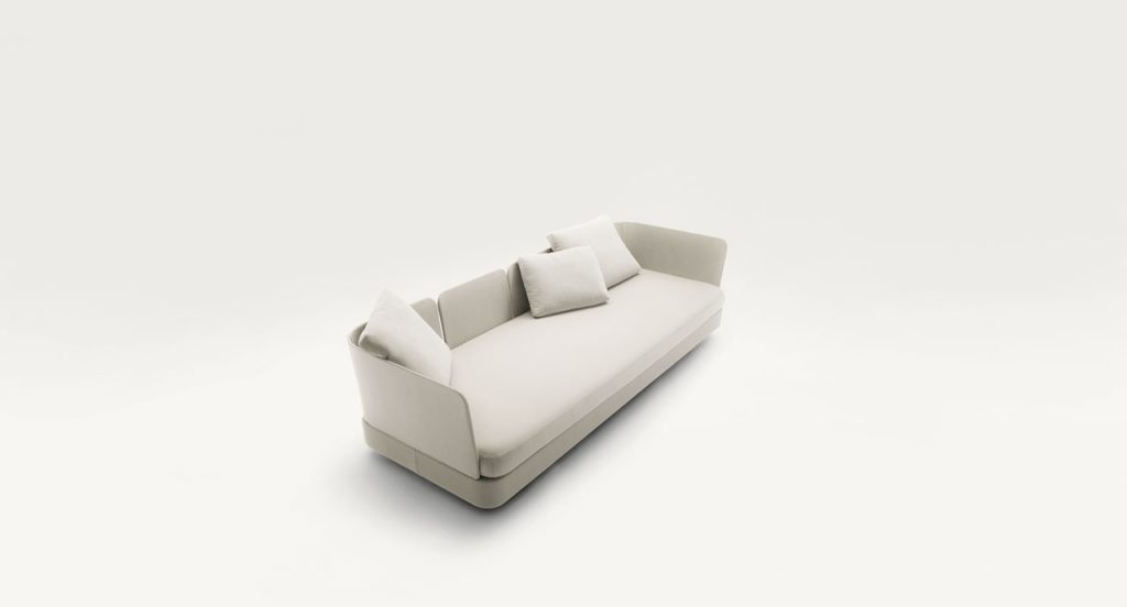 Cove Sectional, upholstered in grey fabrics, cushion in white fabrics on a white background.