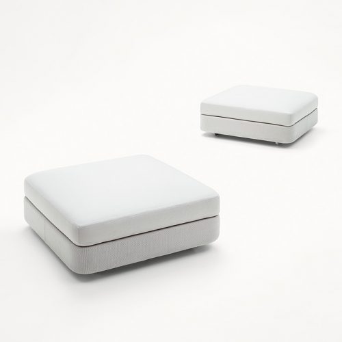 Two Square Cove Poufs, white upholstey on a white background.
