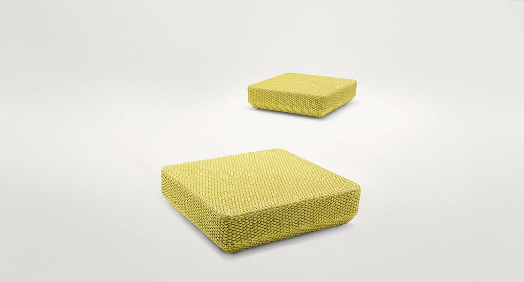 Two Daydream Poufs, upholstery in yellow rope cord on a white background.