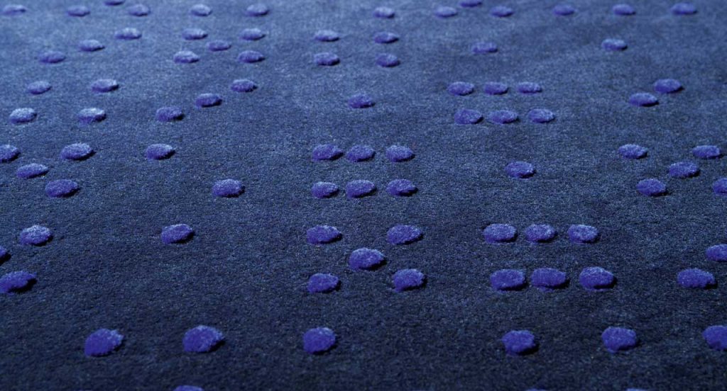 Blue Dice Play rug, round pattern.