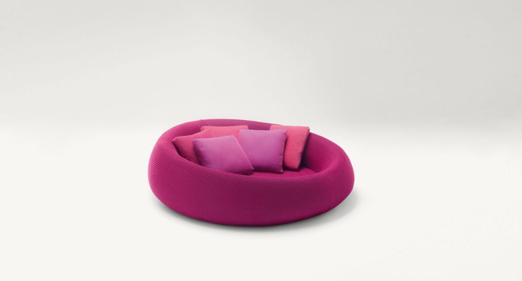 Ease round seating, upholstery in purple on a white background.
