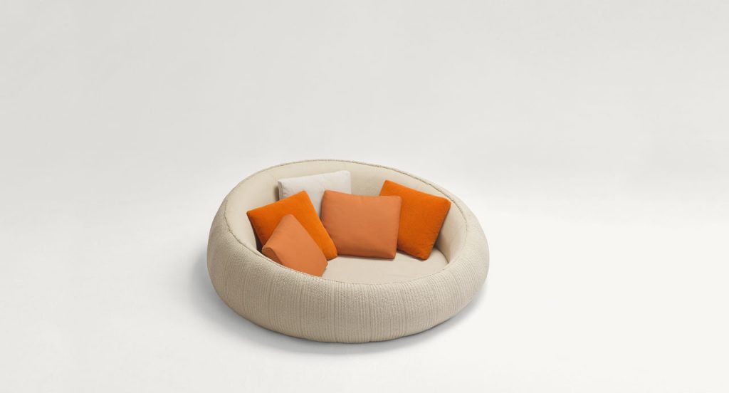 Ease round seating, upholstery in white on a white background.