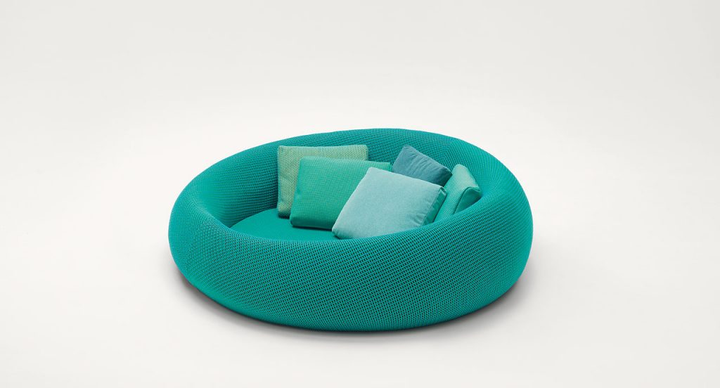 Ease round seating, upholstery in blue on a white background.