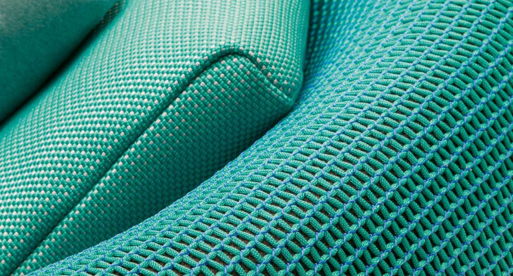 Ease round seating, upholstery in blue.