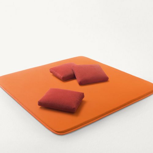 Flex seat pads made of three-dimensional orange polyester fabric.