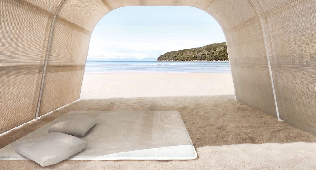 White Flex seat pad made of three-dimensional polyester fabric on a beach.