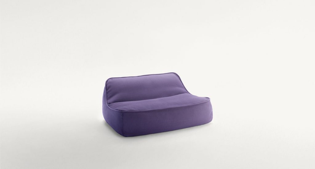 Float Chaise, upholstery in purple fabric on a white background.