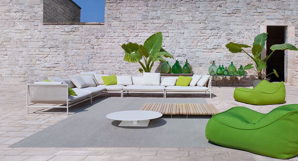 Two Float Chaises, upholstery in green fabric in a terrace.