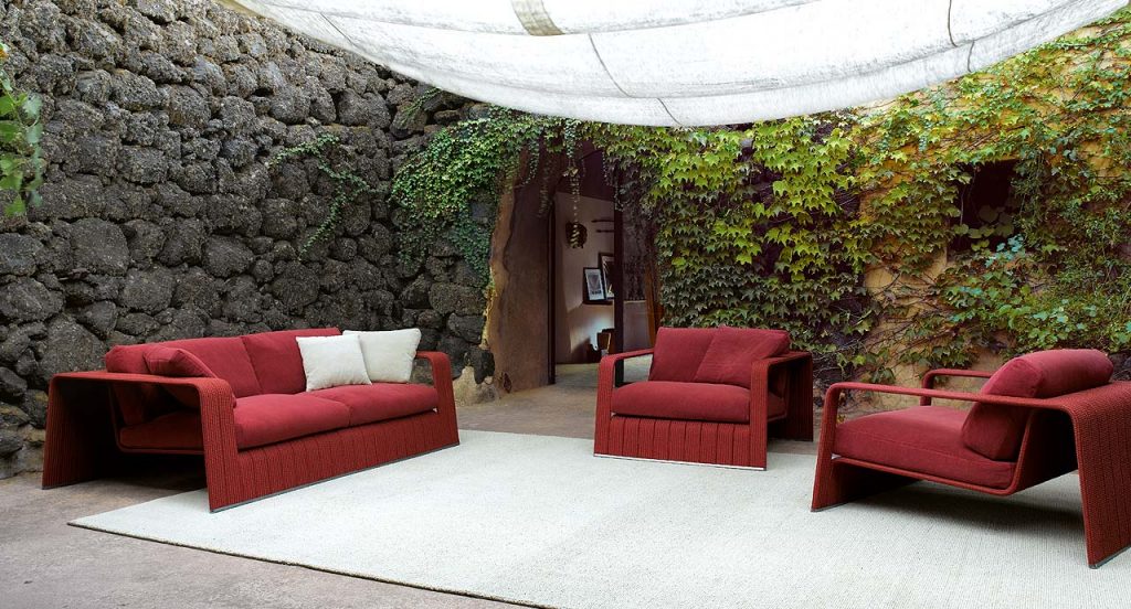 Two red Frame Armchairs, upholstery in rope braids and two cushions in a terrace.