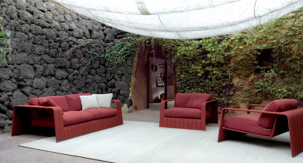 Red Frame Sectional sofa, upholstery in rope braids with four cushions in a terrace.