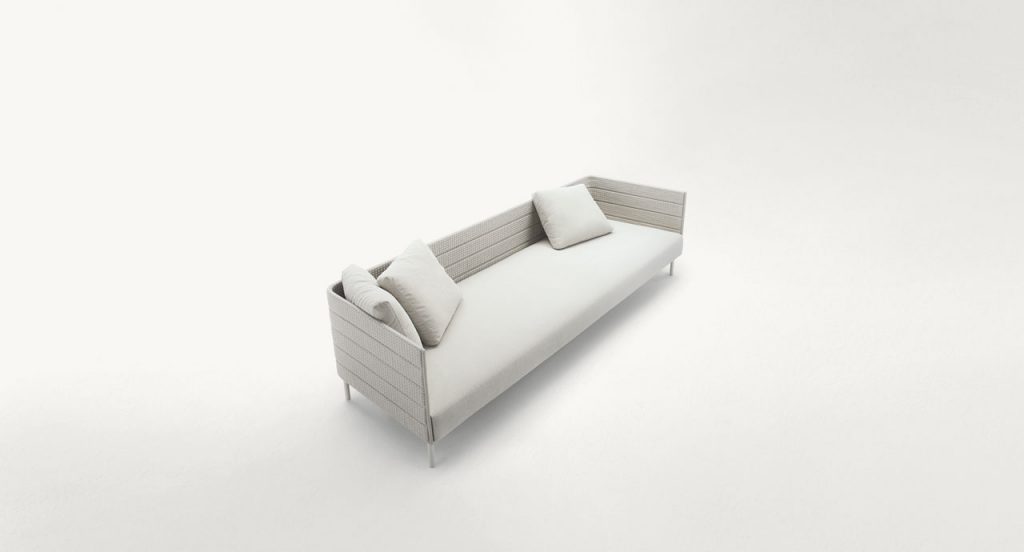Frame on sofa, legs in steel, upholstery in white rope braids, white seat cushion on a white background.