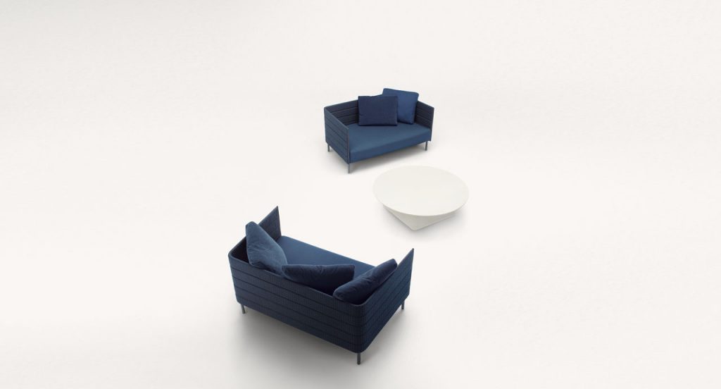 Two Frame on sofa, legs in steel, upholstery in blue rope braids, blue seat cushion on a white background.