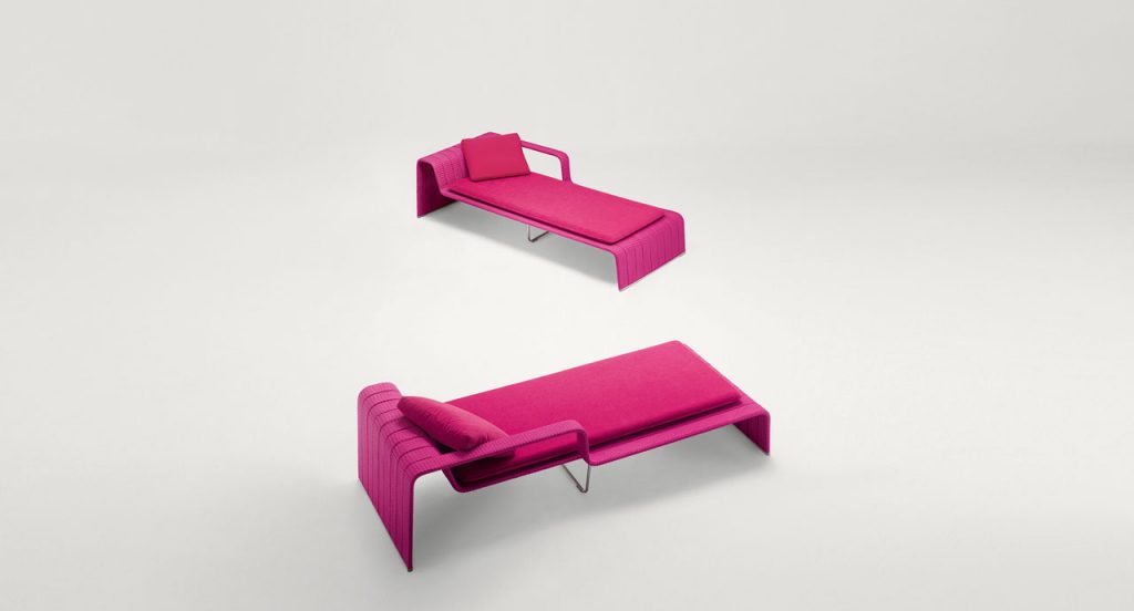 Two Pink Frame Chaises, upholstey of rope braids, seat pad and cushion on a white background.