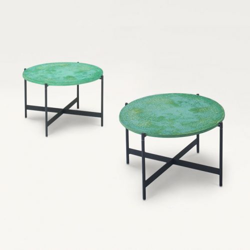 Two Heron Cofee Tables, structure and four legs in balck steel, round top in green on a white background.