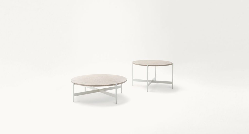 Two Heron Cofee Tables, structure and four legs in white steel, round top in white on a white background.