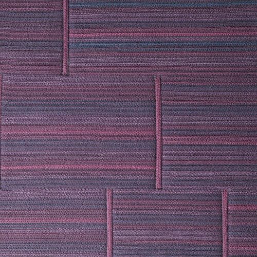 Incroci rug by joining stripes sawn lengthwise made of purple wool cords.