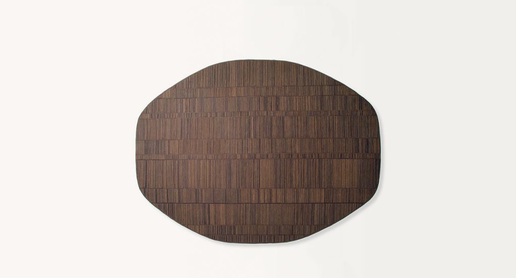 Square Incroci rug by joining stripes sawn lengthwise made of brown wool cords on a white background.