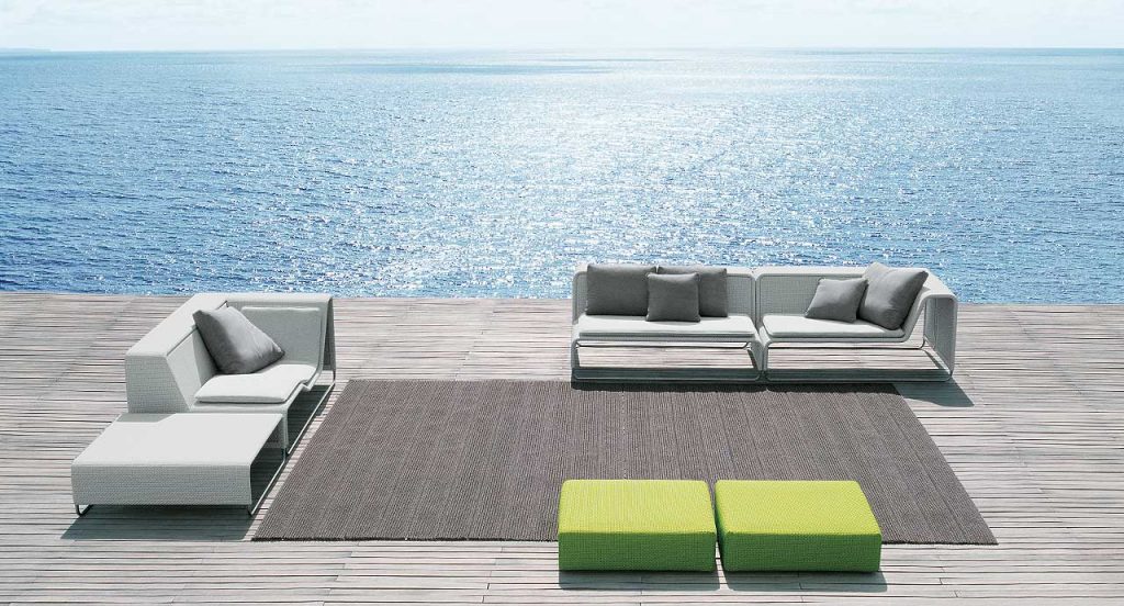 Two green Island Poufs, structure in steel, upholstery in rope fabric in a terrace.