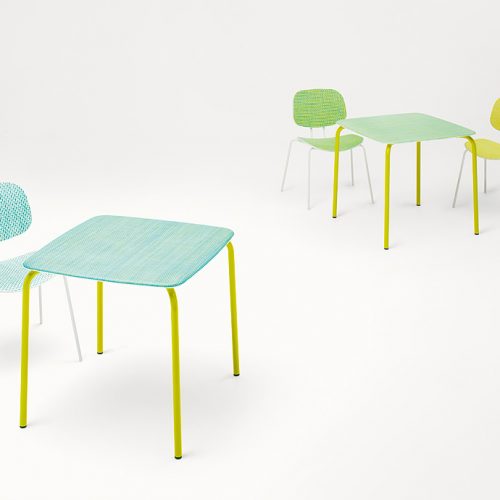 Three Lido Chairs, structure and four legs in white steel, seat and backrest surface of diade, one in blue, one in green and one in yellow on a white background.