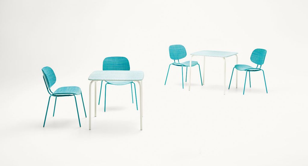 Two Lido Coffee Tables, structure and four legs in white steel, top in blue diade with chairs on a white background.