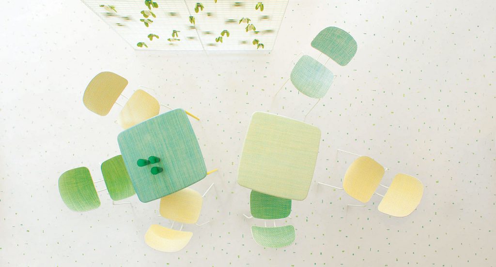 Two Lido Coffee Tables, structure and four legs in green steel, top in diade, one in green and one in yellow in a dining room.