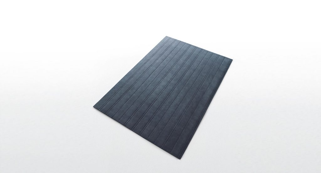 Grey Lines rug in relief made of wool on a white background.