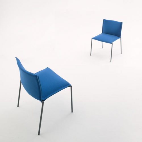 Two Mae chair, structure and legs of black steel, upholstery in blue fabric on a white background.