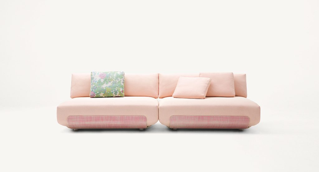 Two pink Oasi, Series of single seatings with backrest on a white background.