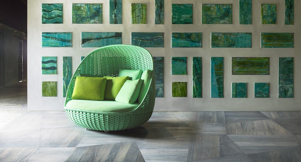 Two Orbitry Armchairs structural weave of flat braid in green Rope yarn with cushion in a living room.