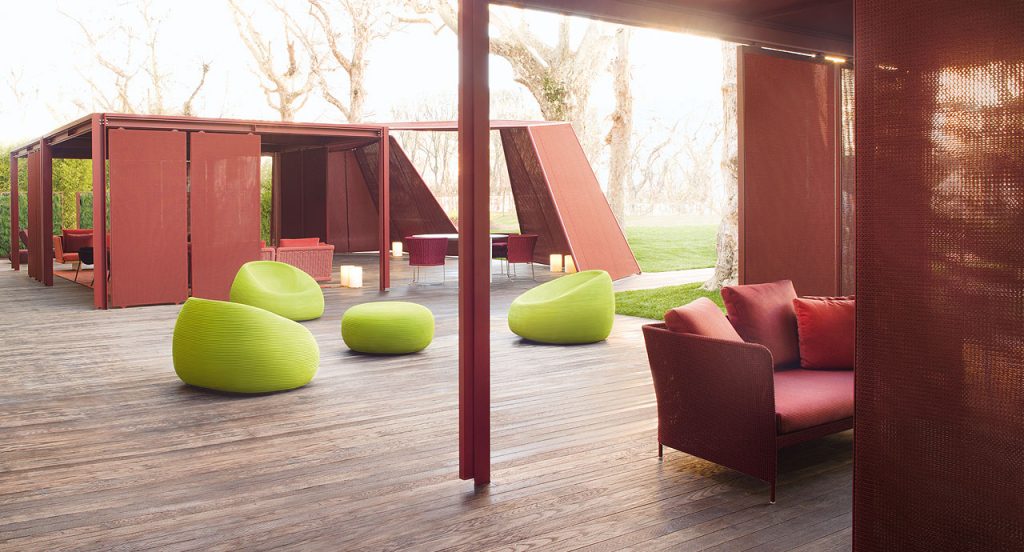 Three Otto Armchairs, upholstery in green rope cord in a terrace.