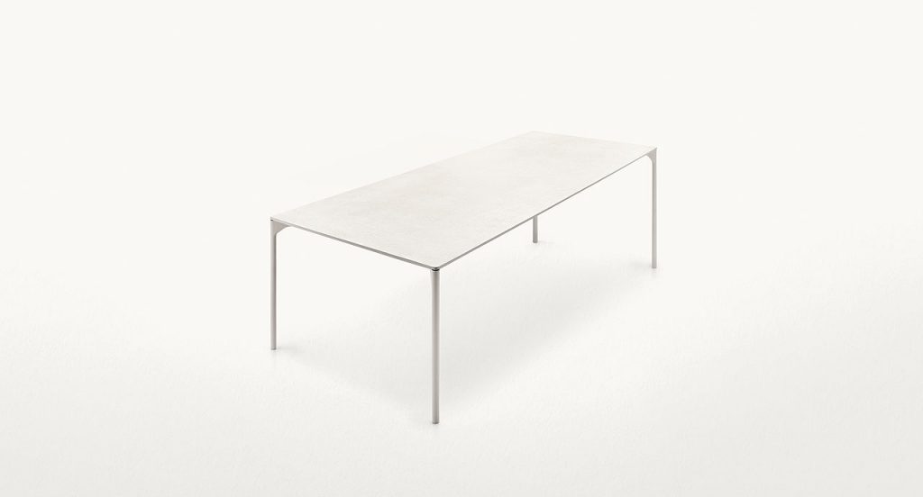 Rectangular Plano Outdoor Dining Table, structure in white steel, shelves in white concrete on a white bakcground.