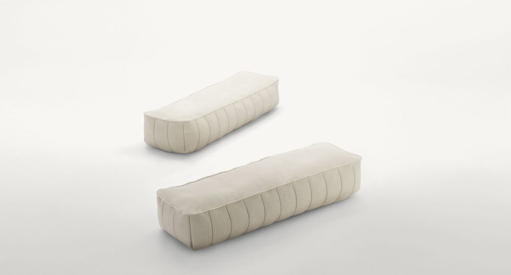 Two Play poufs in white fabric upholstery, rectangular shape on a white background.