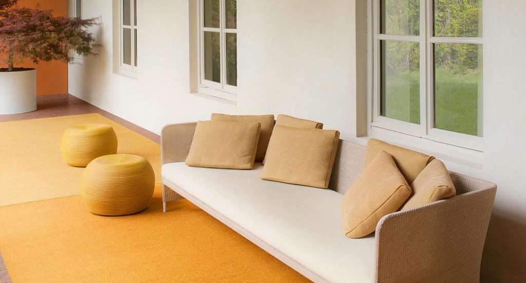Orange Policromo-Policromo Double rug in a living room.