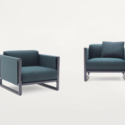 Two Portofino Outdoor Armchairs, structure in black steel, cushions in blue polyester on a white background.